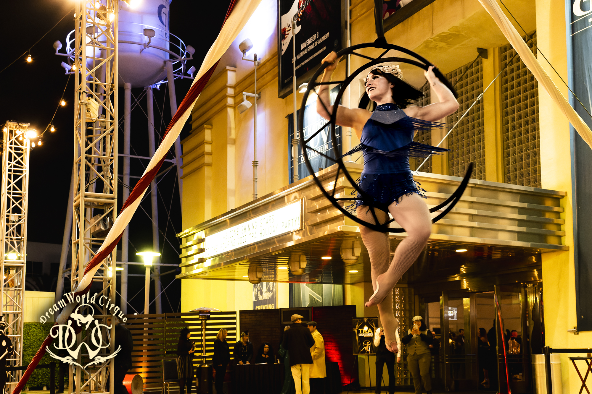 Gatsby-themed aerial moon act outside a theater marquee